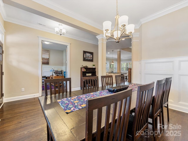 612 Ideal Way, Charlotte, NC 28203 - dining room featuring a chandelier, ornamental molding, dark wood finished floors, and decorative columns