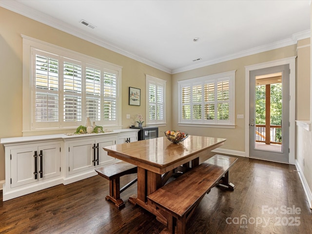 612 Ideal Way, Charlotte, NC 28203 - dining space with dark wood-style flooring, plenty of natural light, and crown molding