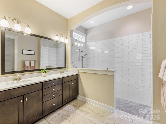 612 Ideal Way, Charlotte, NC 28203 - full bath with double vanity, a walk in shower, recessed lighting, and marble finish floors
