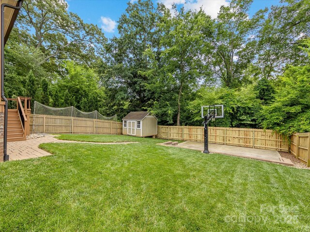 612 Ideal Way, Charlotte, NC 28203 - fenced backyard featuring a storage unit, a patio, view of scattered trees, and stairway