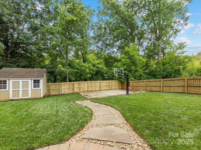 612 Ideal Way, Charlotte, NC 28203 - fenced backyard featuring a storage unit and a patio