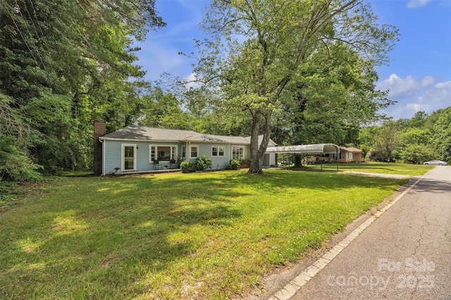 2222 19th Ave NE, Hickory, NC 28601 - view of front of home featuring a detached carport, a chimney, and a front yard