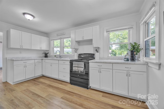2222 19th Ave NE, Hickory, NC 28601 - kitchen featuring black range with electric stovetop, white cabinetry, crown molding, light wood-style floors, and light stone countertops