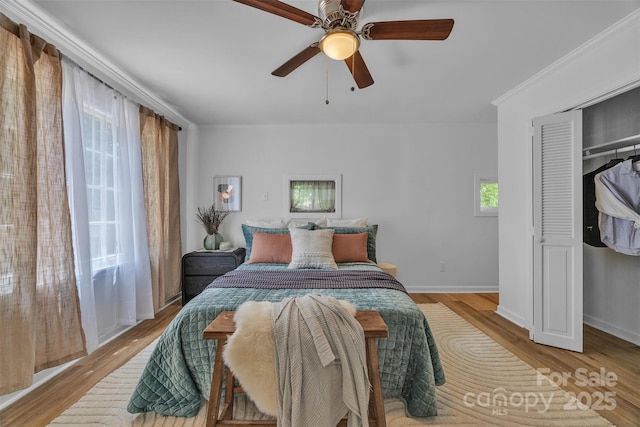 2222 19th Ave NE, Hickory, NC 28601 - bedroom with wood finished floors, ceiling fan, and a closet