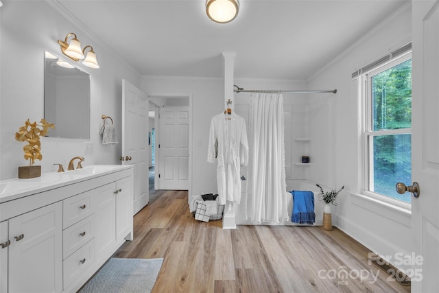 2222 19th Ave NE, Hickory, NC 28601 - bathroom featuring shower / bath combo, vanity, crown molding, and wood finished floors