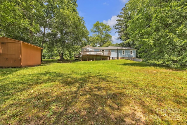 2222 19th Ave NE, Hickory, NC 28601 - view of grassy yard featuring a storage unit and a deck