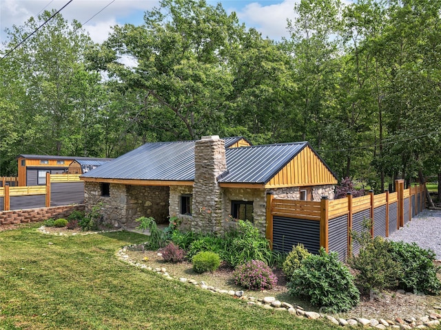 14715 Cruso Rd, Canton, NC 28716 - view of front of house with stone siding, a metal roof, a chimney, and board and batten siding