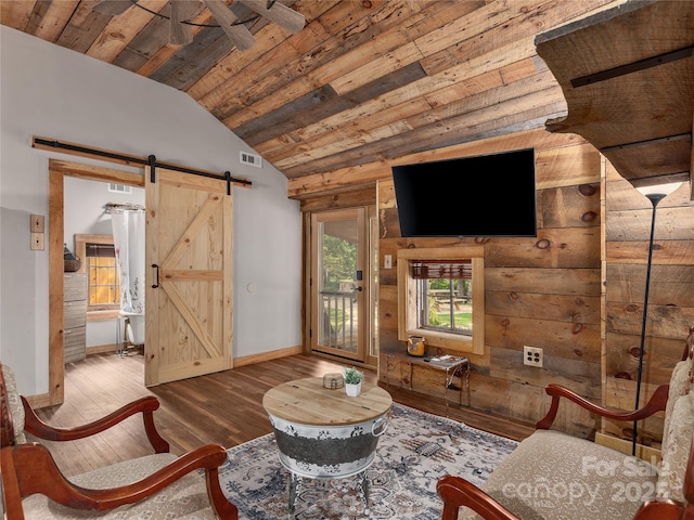 14715 Cruso Rd, Canton, NC 28716 - living area featuring wood ceiling, a barn door, vaulted ceiling, and hardwood / wood-style flooring