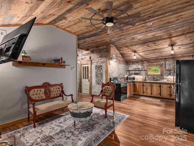 14715 Cruso Rd, Canton, NC 28716 - living room featuring wood ceiling, vaulted ceiling, a ceiling fan, and light wood-style flooring