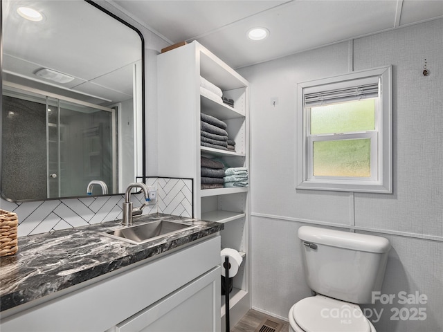 14715 Cruso Rd, Canton, NC 28716 - bathroom featuring vanity, backsplash, a shower stall, and wood finished floors