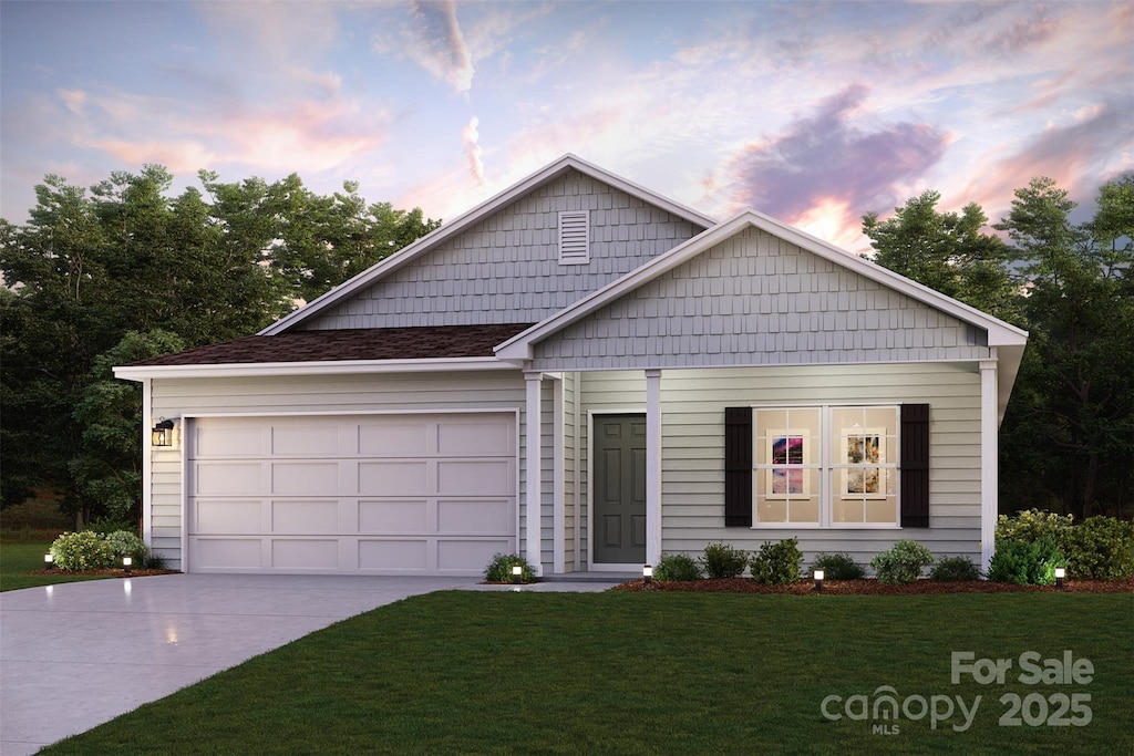 225 Ingleby Rd, Union, SC 29379 - view of front facade with concrete driveway, a front lawn, and an attached garage
