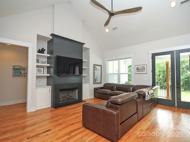 4282 Brandy Creek Ct, Clover, SC 29710 - living area featuring high vaulted ceiling, healthy amount of natural light, a fireplace, a ceiling fan, and light wood-style flooring