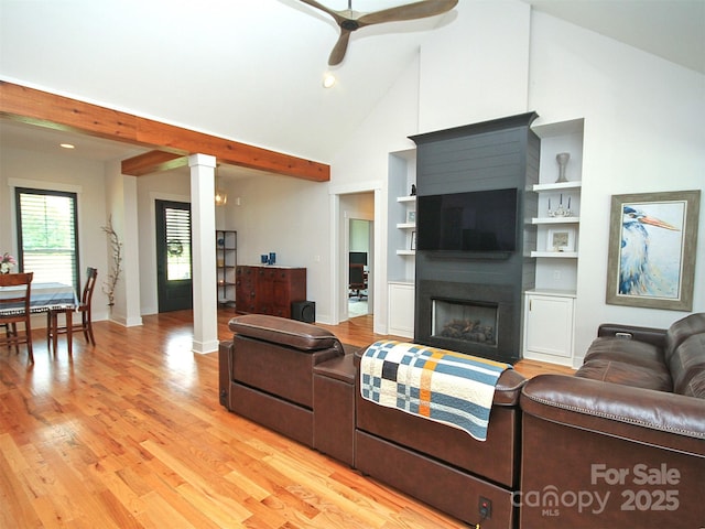 4282 Brandy Creek Ct, Clover, SC 29710 - living room featuring decorative columns, light wood-type flooring, ceiling fan, a fireplace, and high vaulted ceiling