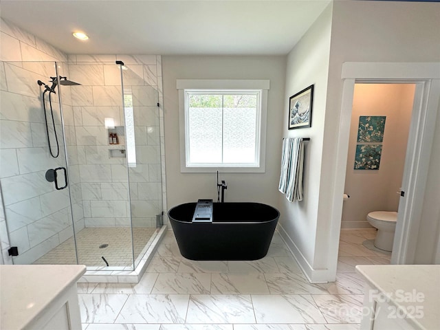 4282 Brandy Creek Ct, Clover, SC 29710 - full bathroom featuring a shower stall, vanity, marble look tile flooring, a freestanding tub, and recessed lighting