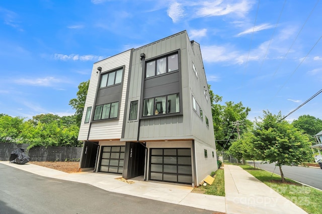 1933 W Trade St, Charlotte, NC 28216 - contemporary house featuring a garage and board and batten siding
