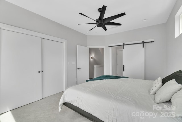 1933 W Trade St, Charlotte, NC 28216 - bedroom featuring carpet, a barn door, a closet, and ceiling fan