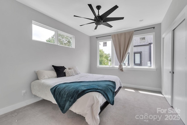 1933 W Trade St, Charlotte, NC 28216 - bedroom with multiple windows, carpet, and a closet