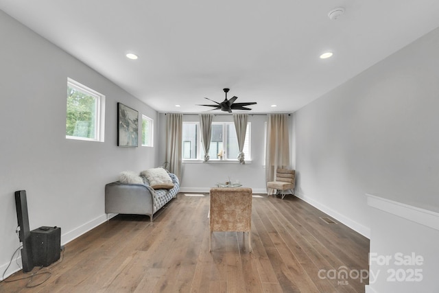 1933 W Trade St, Charlotte, NC 28216 - living area featuring wood finished floors, ceiling fan, and recessed lighting