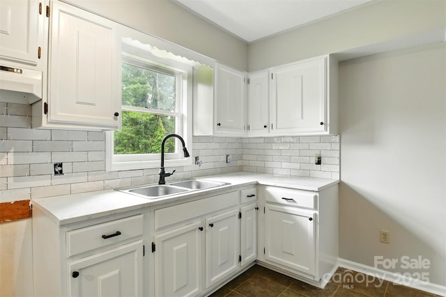 3404 Sheely Rd, Lenoir, NC 28645 - kitchen featuring white cabinetry, dark tile patterned floors, light countertops, and tasteful backsplash