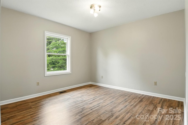 3404 Sheely Rd, Lenoir, NC 28645 - empty room featuring wood finished floors and baseboards