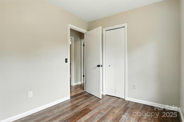 3404 Sheely Rd, Lenoir, NC 28645 - unfurnished bedroom featuring wood finished floors and a closet