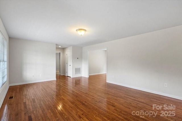 1011 Atherstone St NW, Conover, NC 28613 - empty room featuring hardwood / wood-style flooring and baseboards
