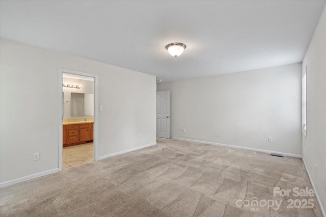 1011 Atherstone St NW, Conover, NC 28613 - unfurnished bedroom featuring light carpet and ensuite bath