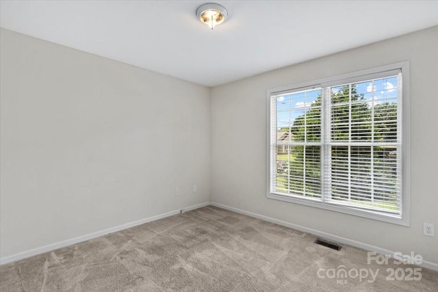 1011 Atherstone St NW, Conover, NC 28613 - carpeted empty room featuring baseboards