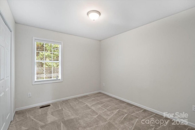 1011 Atherstone St NW, Conover, NC 28613 - spare room featuring light carpet and baseboards