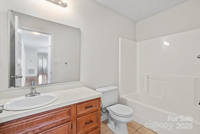 1011 Atherstone St NW, Conover, NC 28613 - bathroom featuring tile patterned flooring, vanity, and washtub / shower combination