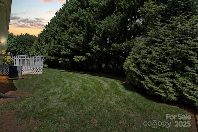 1011 Atherstone St NW, Conover, NC 28613 - view of green lawn with a wooden deck and a wooded view