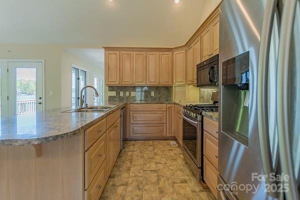 639 Panther Point Trl, Richfield, NC 28137 - kitchen with stainless steel appliances, light brown cabinetry, a peninsula, tasteful backsplash, and recessed lighting