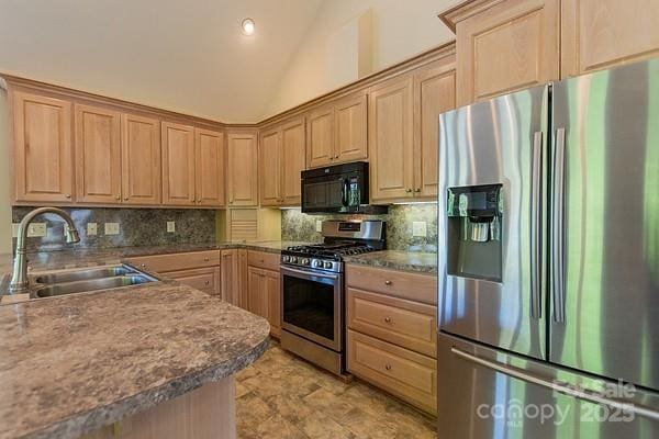 639 Panther Point Trl, Richfield, NC 28137 - kitchen featuring appliances with stainless steel finishes, backsplash, light brown cabinets, vaulted ceiling, and recessed lighting