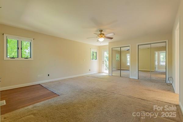 639 Panther Point Trl, Richfield, NC 28137 - unfurnished bedroom with multiple closets, carpet floors, and ceiling fan