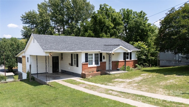 820 Baldwin Ave, Marion, NC 28752 - view of front of house featuring a front yard, a shingled roof, and an attached carport