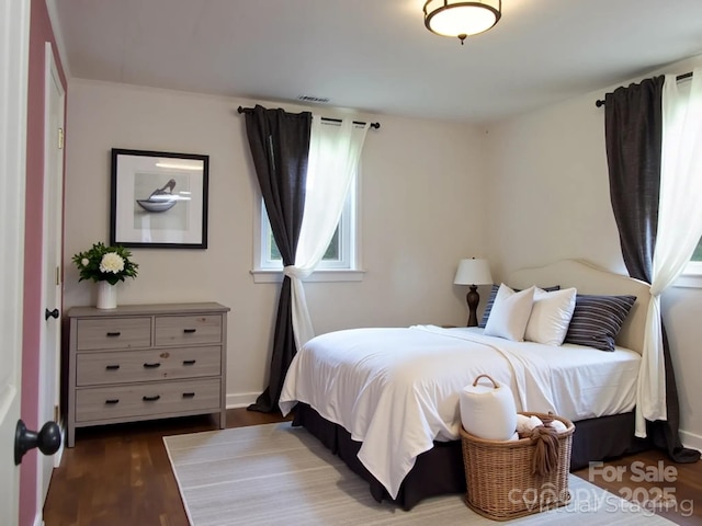 820 Baldwin Ave, Marion, NC 28752 - bedroom with dark wood-style floors and baseboards