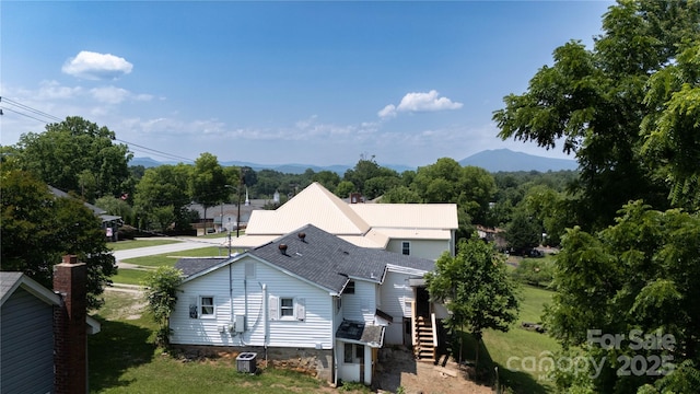 820 Baldwin Ave, Marion, NC 28752 - rear view of property featuring stairs, a shingled roof, a lawn, and a mountain view