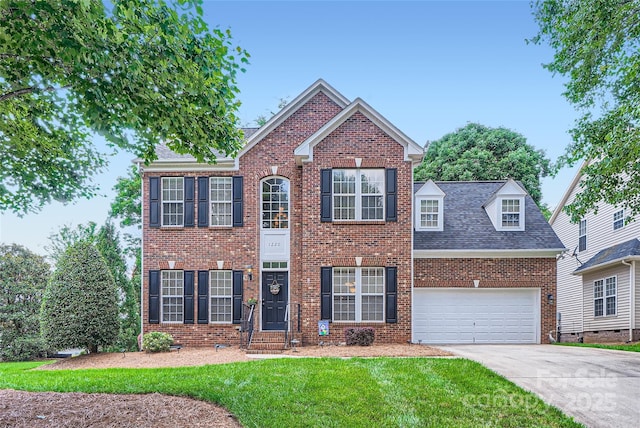 1220 Elrond Dr NW, Charlotte, NC 28269 - view of front of house featuring brick siding, a garage, driveway, a front yard, and a shingled roof