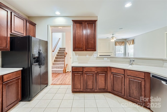 1220 Elrond Dr NW, Charlotte, NC 28269 - kitchen featuring dishwasher, black fridge with ice dispenser, light tile patterned floors, ceiling fan, and light countertops