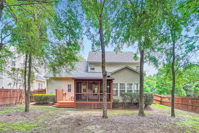 1220 Elrond Dr NW, Charlotte, NC 28269 - rear view of house with a fenced backyard, a sunroom, a wooden deck, and ceiling fan