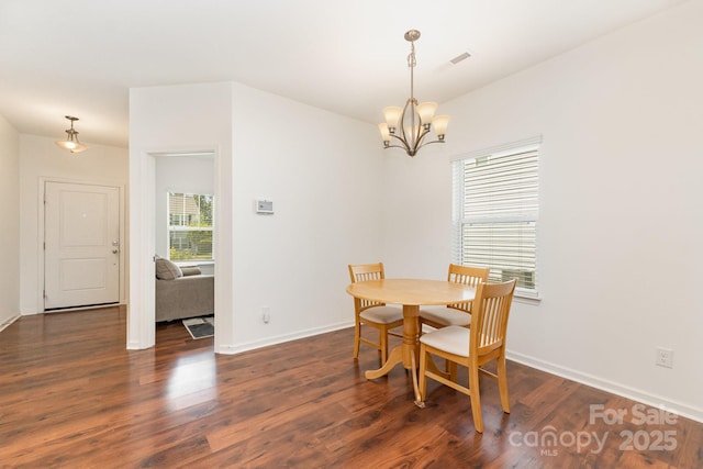 1691 Ashley Lynn Ct, Stanfield, NC 28163 - dining space with a chandelier and wood finished floors