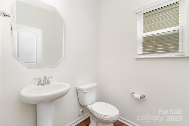 1691 Ashley Lynn Ct, Stanfield, NC 28163 - half bathroom with toilet and wood finished floors