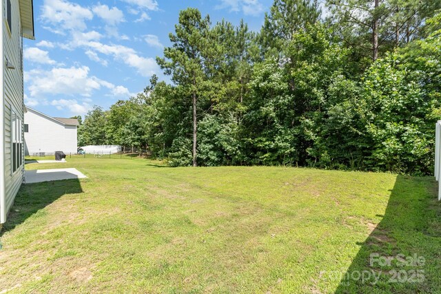 1691 Ashley Lynn Ct, Stanfield, NC 28163 - view of green lawn featuring a patio