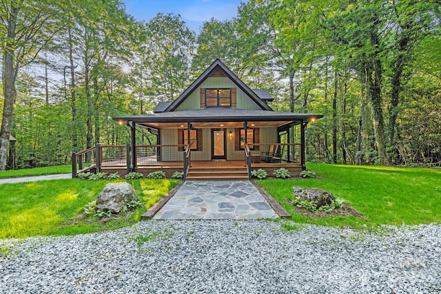 327 Flat Ridge Dr, Lake Toxaway, NC 28774 - view of front facade with a front yard and covered porch
