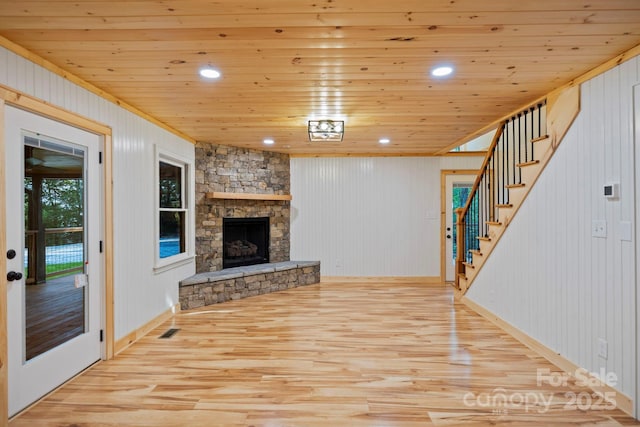 327 Flat Ridge Dr, Lake Toxaway, NC 28774 - unfurnished living room featuring wood finished floors, stairway, a fireplace, wooden walls, and wood ceiling