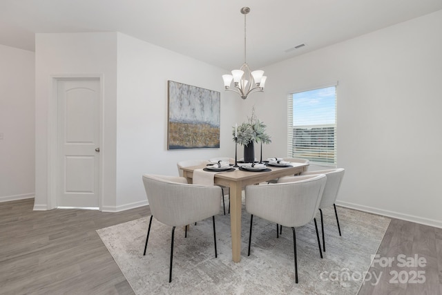 4060 Beacon Ave Unit 148, Monroe, NC 28110 - dining room with a chandelier and light wood-style flooring