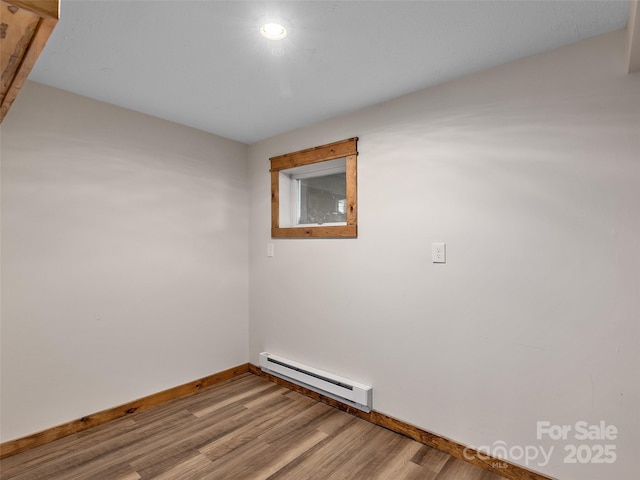 505 Scenic Cir, Waynesville, NC 28786 - spare room with baseboard heating and wood finished floors