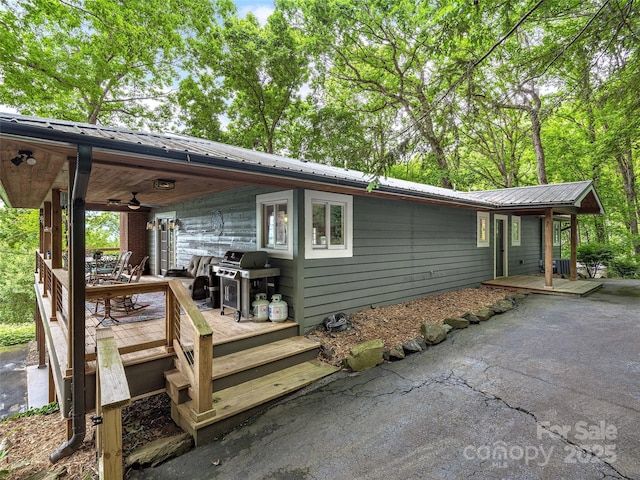 505 Scenic Cir, Waynesville, NC 28786 - view of property exterior with ceiling fan, a metal roof, and a deck