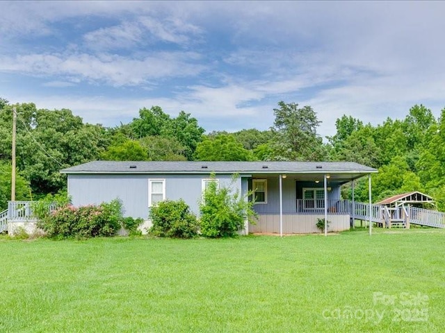 1406 Old Puckett Pl Unit 14, York, SC 29745 - rear view of property featuring a lawn and a porch