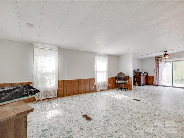 1406 Old Puckett Pl Unit 14, York, SC 29745 - living area with wainscoting, wood walls, and a ceiling fan